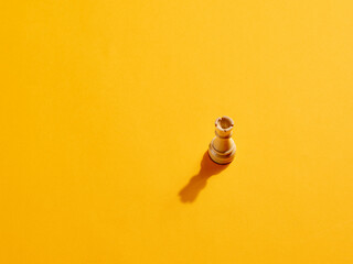 Rook or castle chess piece on yellow background
