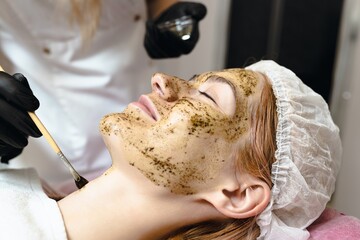 Close-up of a patient's face at a cosmetologist's appointment