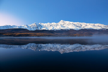 Fototapeta na wymiar View of Lake Dzhangyskol and the North Chui ridge at dawn. Gorny Altai, Russia