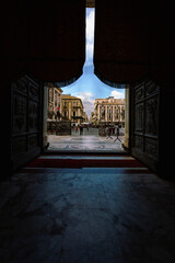 Entrance of the Cathedral of Catania with person entering