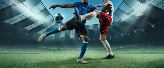 Cropped image of two soccer, football players in motion, action at stadium during football match....