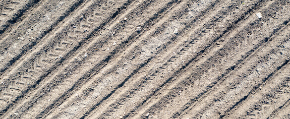 Banner of clear plowed field with traces. View from the top.