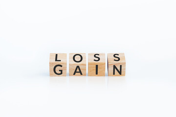turn loss into gain concept, wooden cube with word LOSS flip to GAIN. capital investment gain and loss, financial while managing assets e.g. bonds, stocks, derivatives, ETFs, Crypto currency, forex - obrazy, fototapety, plakaty