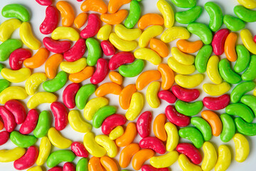 Close up Mixed colorful sweet sugar candy shape like bean on white background                           