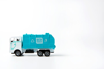 Clean truck model with recycle bin symbol and words “ Eco truck “ logo on truck on white background, garbage truck friendly environment, copy space                                