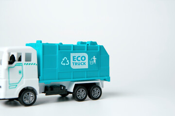Fototapeta premium Close up Trucks model with logo Eco truck and recycle bin symbol on white background, friendly with environment 