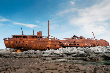 Plassey shipwreck on shore of Inisheer island. Aran islands, county Galway, Ireland. Rough stone...