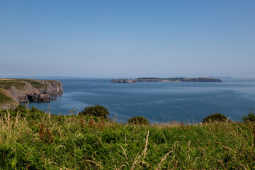 Fototapeta na wymiar The Pembrokeshire Coastline Underneath a Blue Sky