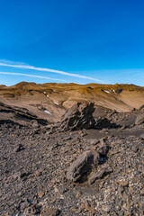 Cover page with Icelandic landscape of colorful volcanic caldera Askja, in the middle of volcanic desert in Highlands, with red, turquoise volcano soil and blue sky, Iceland.