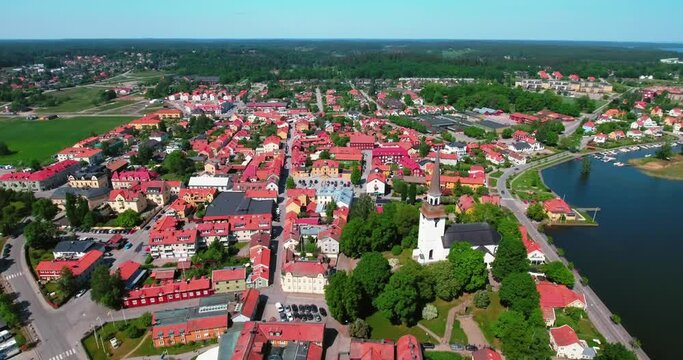 Aerial Shot Of Religious Structure Amidst Residential Houses In City By Sea On Sunny Day - Stockholm, Sweden