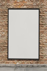 Blank Poster frame / Billboard / Display on an old factory brick wall - Mockup
