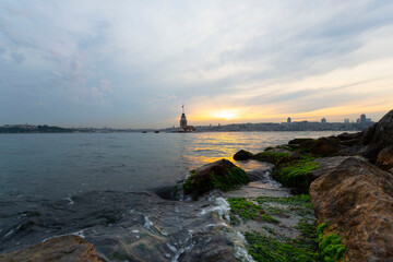 Istanbul, Turkey. Sunset over Bosphorus with famous Maiden's Tower (Kiz Kulesi) symbol of Istanbul,...