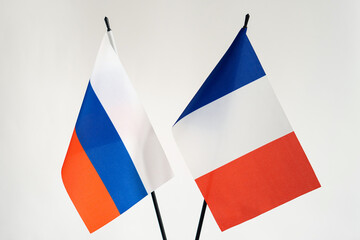 State flags of Russia and France on white background.Cooperation business conflict sanctions concept