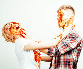 young pretty couple, lifestyle people concept: girlfriend and boyfriend cooking together, having...