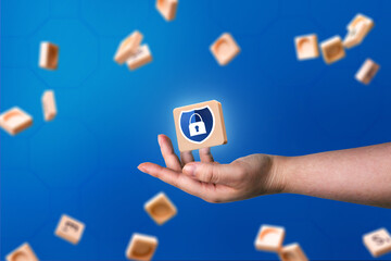 Hand showing blue security shield protection with blue background and copy space. Internet of things. Cyber security concept. Protection and privacy. Business technology.