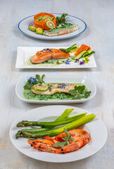 Presentation of fish plates.On white