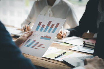 Meeting room atmosphere and business groups are meeting, discussing and planning business operations for more profitable growth. Concept of business meeting and company administration.