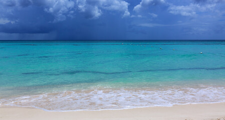 Travel background with clouds sky and Caribbean sea.