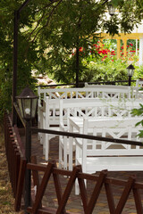 small cafe with an outdoor terrace in the shade of trees