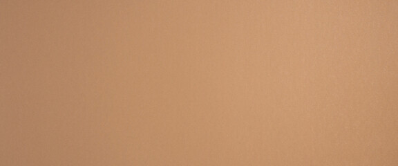 Pure light brown sandy gold cardboard background. Top view, flat lay. Banner