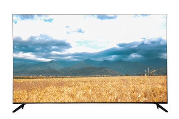 Modern wide screen TV monitor showing picturesque view of wheat field and cloudy sky isolated on...