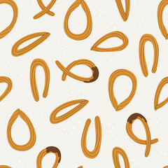 Fototapeta na wymiar Seamless pattern with churros. Spanish traditional pastries. Endlessly repeating churros. Vector illustration for design.