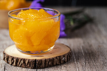 Orange in syrup in clear dessert glass