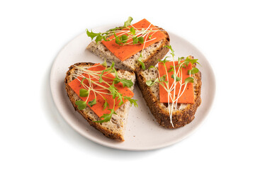 Grain bread sandwiches with red tomato cheese and microgreen isolated on white, side view, close up.