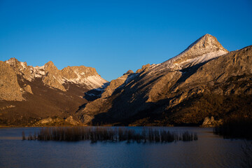 Fototapeta na wymiar Sunrise over mountains at Riaño reservoir in Spain