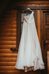 Fototapeta na wymiar Beautiful wedding dress on a hanger stock photo.