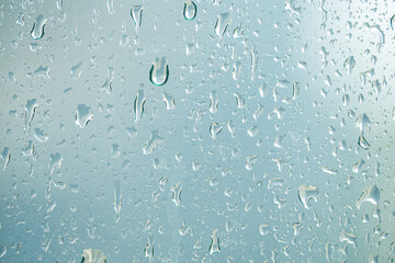 selective focus of rain drop on glass window.
