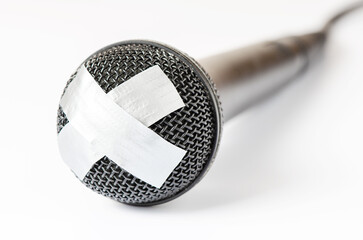 The microphone is sealed with sticky tape. The concept of restricting freedom of speech or obscene...