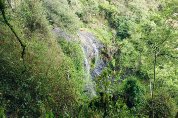 Obraz premium Scenic view of Kipkaren Waterfall in the forest at Elgeyo Marakwet County, Kenya