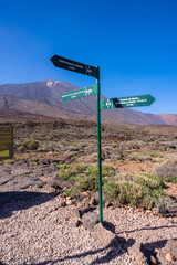 Signs of the trail between Roques de Gracia and Roque Cinchado in the natural area of Teide in Tenerife, Canary Islands
