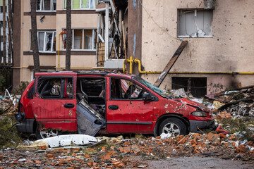 Irpin, Kyev region Ukraine - 09.04.2022: Cities of Ukraine after the Russian occupation. On the streets of Irpin. Shot cars. Irpin, Bucha, Gostomel.