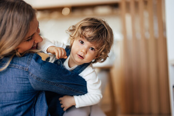 Portrait of a cute toddler, posing for the camera while spending