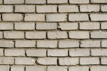 Old urban white brick wall, close-up