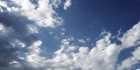 Fototapeta premium Panoramic photo of blurred sky. Blue sky background with cumulus clouds