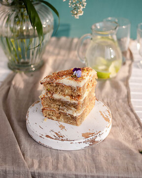 Jamaican Humming bird cake with pine apple banana on a plate against green background