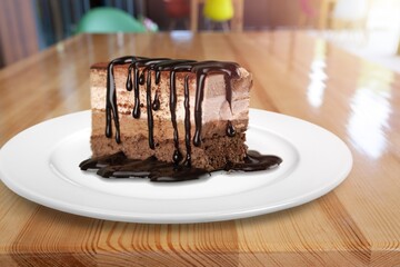 Square brownie chocolate one slice on white plate.