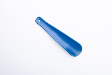 blue plastic shoehorn on a white background