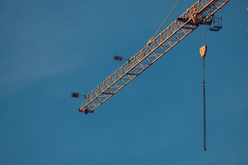 Tower crane over a house under construction