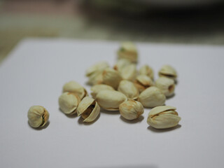Fototapeta na wymiar Pistachio dried bean on white background, top view