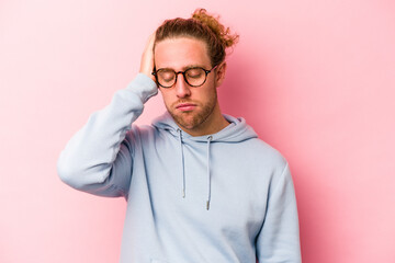 Young caucasian man isolated on pink background tired and very sleepy keeping hand on head.