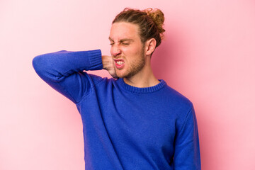 Young caucasian man isolated on pink background tired and very sleepy keeping hand on head.