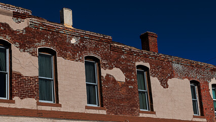 Windows in a colorful brick wall