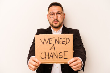 Hispanic business man holding wee need a change placard isolated on white background