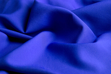 Folds of blue fabric for the background.