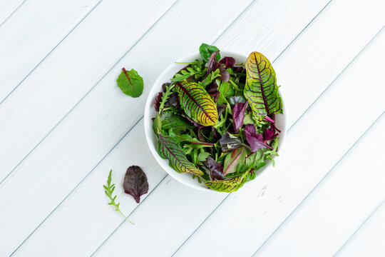 Fresh salad leaves in bowl