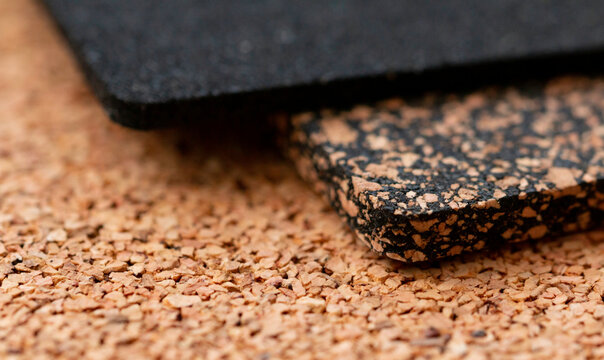 A close-up of a rubberized and rubberless cork plate with a shallow depth of field